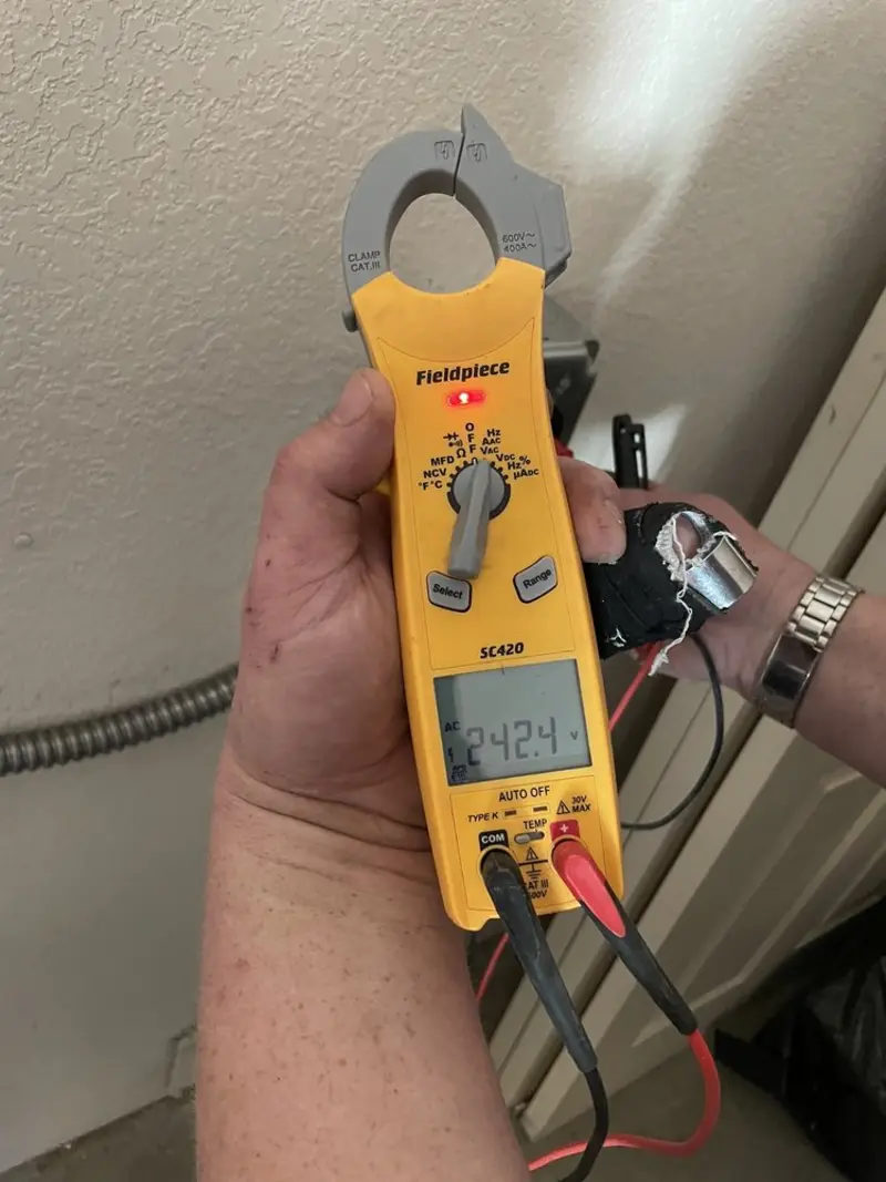 Voltage testing with clamp meter during Outlet Installation in Duryea
